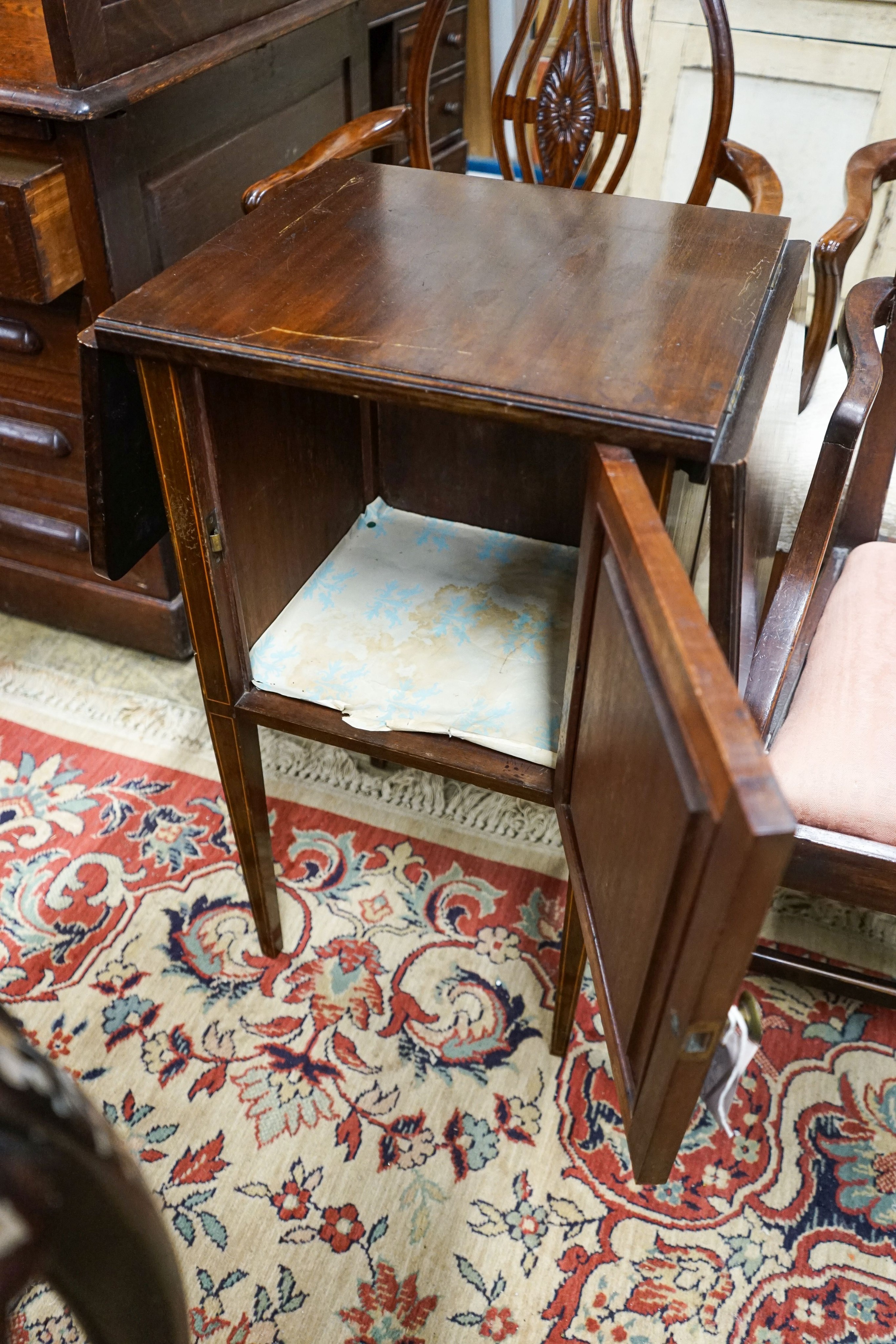 A pair of Hepplewhite style elbow chairs with oval backs, one other chair and a bedside commode cabinet (4)
